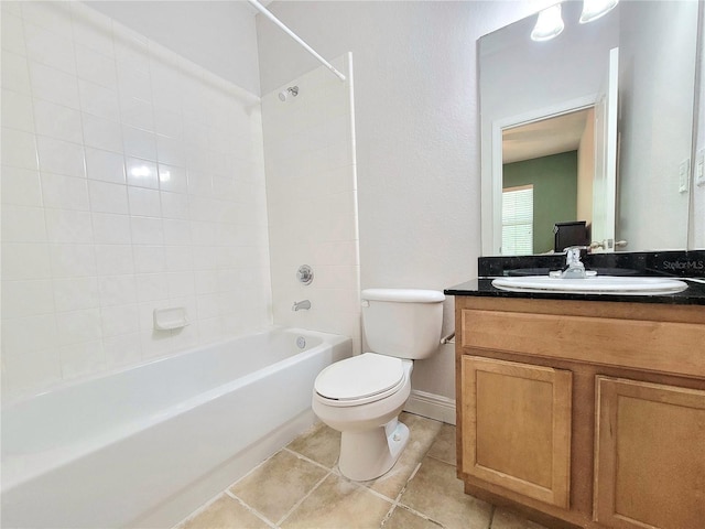 bathroom featuring toilet, shower / bath combination, tile patterned floors, vanity, and baseboards