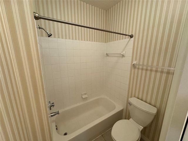 10000 SW 52nd Ave Unit 76, Gainesville, FL 32608 - bathroom with toilet, wallpapered walls, and tub / shower combination