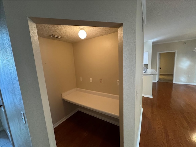10000 SW 52nd Ave Unit 76, Gainesville, FL 32608 - mudroom featuring visible vents, baseboards, a textured wall, a textured ceiling, and wood finished floors