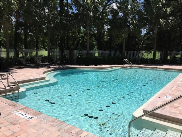 10000 SW 52nd Ave Unit 76, Gainesville, FL 32608 - pool with a patio area and fence