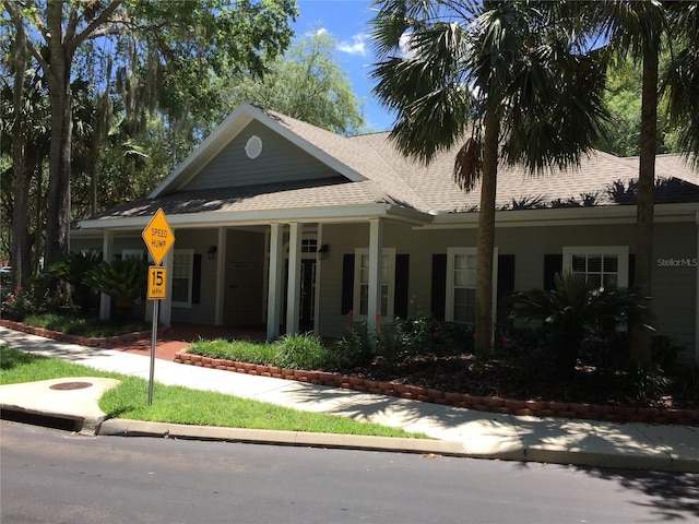 10000 SW 52nd Ave Unit 76, Gainesville, FL 32608 - view of front of house featuring roof with shingles and covered porch
