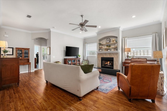 2184 NW 144th St, Newberry, FL 32669 - living area with a fireplace, wood finished floors, visible vents, and ceiling fan