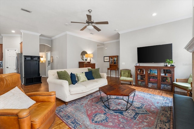 2184 NW 144th St, Newberry, FL 32669 - living room featuring arched walkways, recessed lighting, wood finished floors, ceiling fan, and crown molding