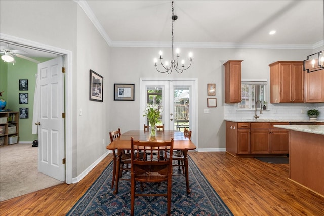 2184 NW 144th St, Newberry, FL 32669 - dining area featuring ornamental molding, a healthy amount of sunlight, and dark wood-type flooring