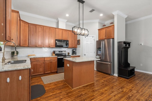 2184 NW 144th St, Newberry, FL 32669 - kitchen featuring a center island, tasteful backsplash, a sink, crown molding, and appliances with stainless steel finishes