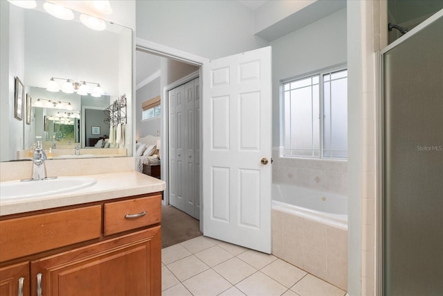 2184 NW 144th St, Newberry, FL 32669 - full bath featuring a shower with shower door, tile patterned flooring, vanity, ensuite bath, and a garden tub