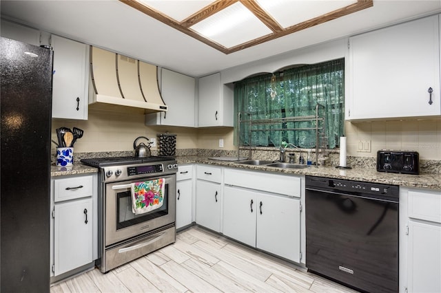 kitchen with black appliances, custom exhaust hood, tasteful backsplash, and a sink