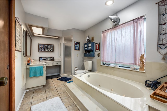 bathroom with tile patterned floors, a whirlpool tub, toilet, vanity, and a stall shower
