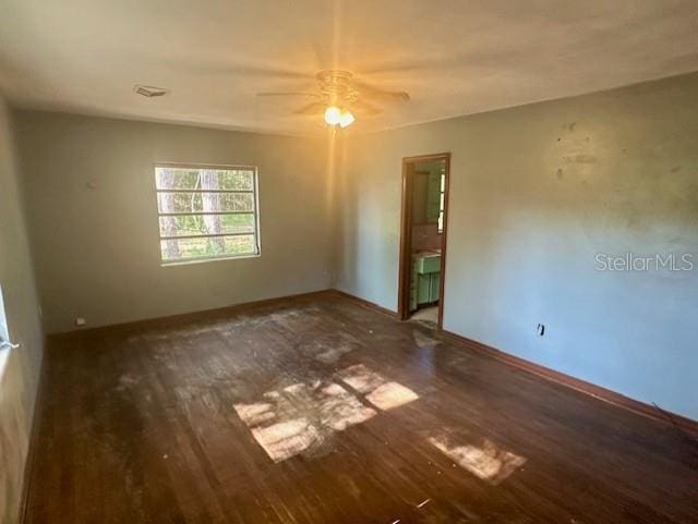 3530 NW County Road 236, Bell, FL 32619 - spare room featuring visible vents, ceiling fan, wood finished floors, and baseboards