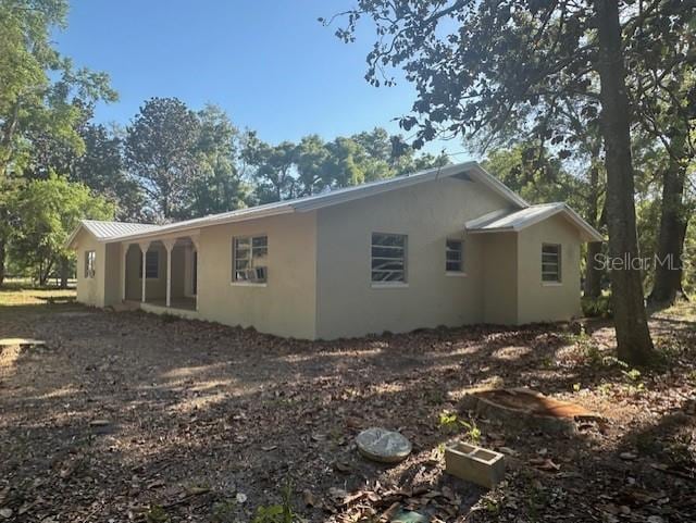 3530 NW County Road 236, Bell, FL 32619 - view of side of home with stucco siding