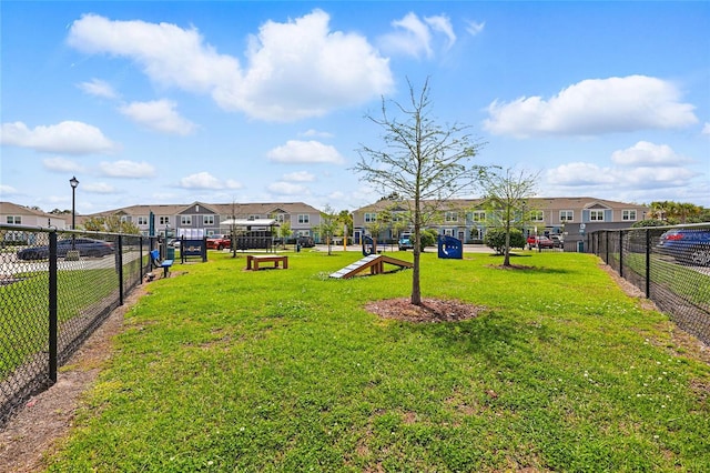 view of yard featuring a residential view and fence