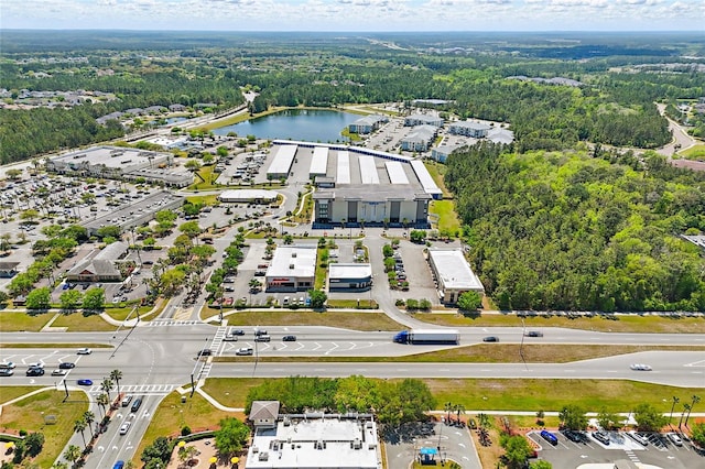 bird's eye view featuring a water view and a view of trees
