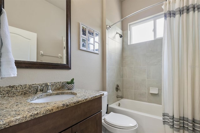bathroom featuring toilet, shower / bath combo, and vanity
