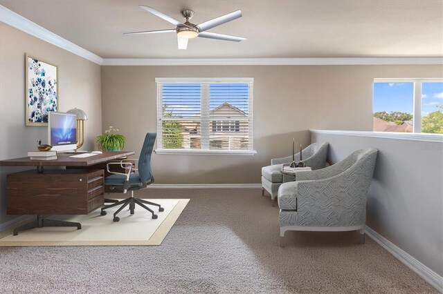 carpeted office featuring crown molding, baseboards, and ceiling fan