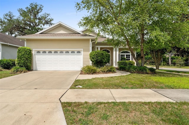 3624 SW 73rd Way, Gainesville, FL 32608 - ranch-style home featuring a garage, driveway, and a front lawn