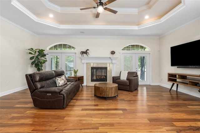 3624 SW 73rd Way, Gainesville, FL 32608 - living room with french doors, a tray ceiling, wood finished floors, ceiling fan, and crown molding