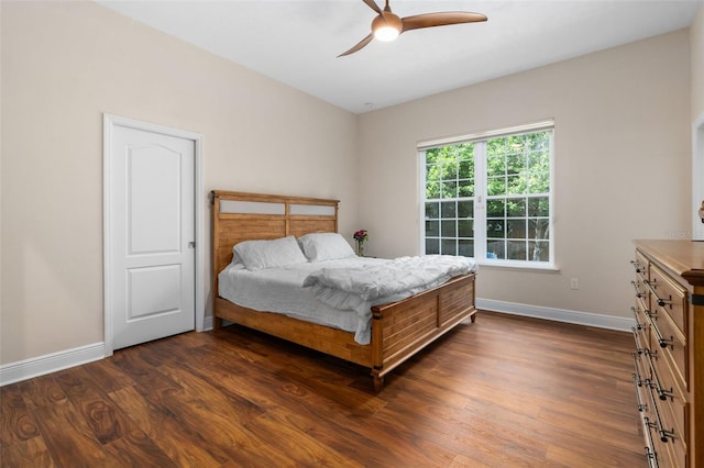 3624 SW 73rd Way, Gainesville, FL 32608 - bedroom featuring dark wood-style flooring, baseboards, and ceiling fan