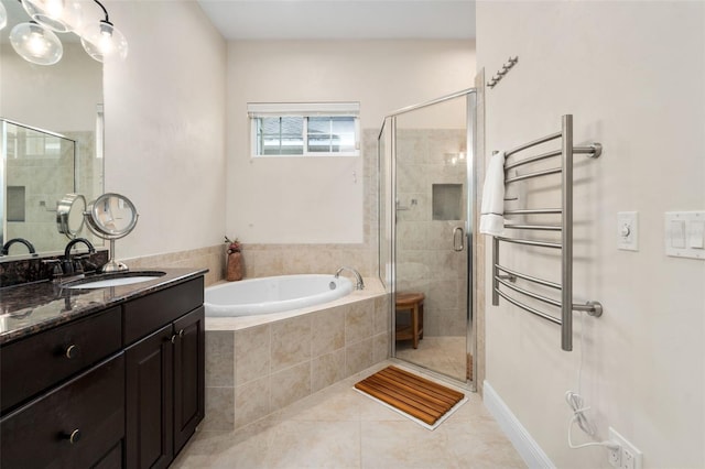 3624 SW 73rd Way, Gainesville, FL 32608 - bathroom featuring a bath, tile patterned flooring, vanity, a stall shower, and radiator