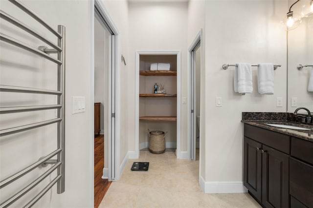 3624 SW 73rd Way, Gainesville, FL 32608 - bathroom featuring vanity, baseboards, and tile patterned floors