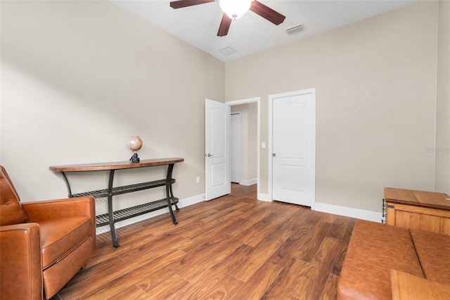 3624 SW 73rd Way, Gainesville, FL 32608 - sitting room featuring wood finished floors, a ceiling fan, and baseboards