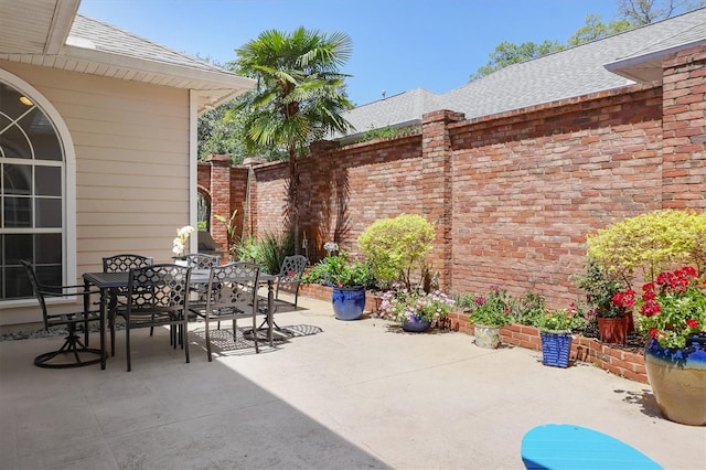 10321 NW 34th Ln, Gainesville, FL 32606 - view of patio featuring fence and outdoor dining space