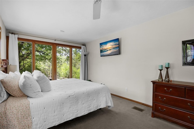 bedroom with visible vents, baseboards, carpet floors, and ceiling fan