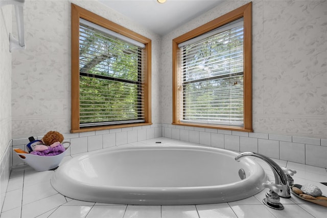 full bathroom featuring a bath and wallpapered walls