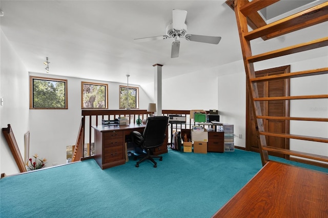 carpeted office space featuring a ceiling fan and plenty of natural light