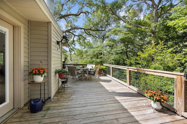 deck with outdoor dining space