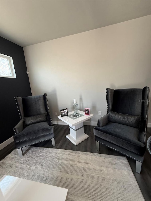 sitting room featuring wood finished floors and baseboards
