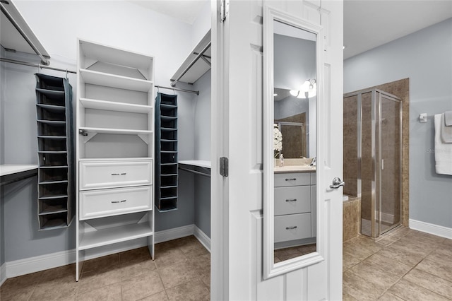 walk in closet featuring light tile patterned floors