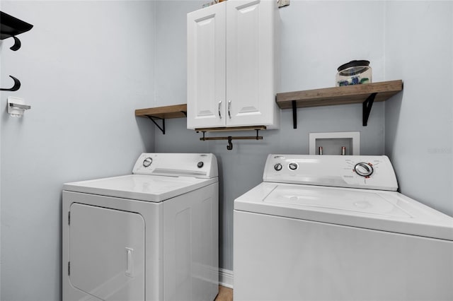 laundry room with cabinet space and independent washer and dryer