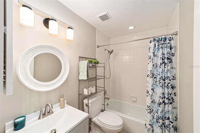 706 NE 1st St Unit 706, Gainesville, FL 32601 - bathroom with recessed lighting, shower / bath combination with curtain, toilet, vanity, and visible vents