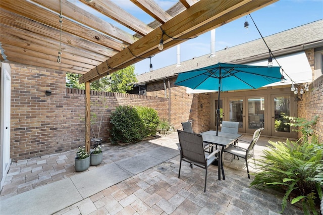 706 NE 1st St Unit 706, Gainesville, FL 32601 - view of patio / terrace with fence, a pergola, french doors, and outdoor dining area