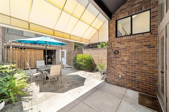 706 NE 1st St Unit 706, Gainesville, FL 32601 - view of patio / terrace with fence and outdoor dining area