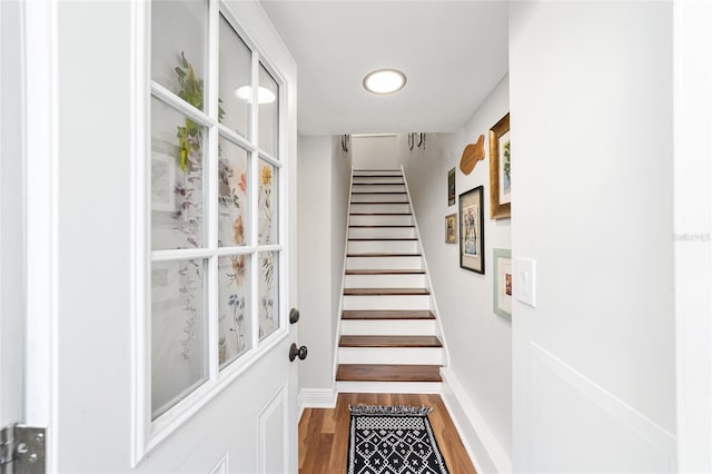 706 NE 1st St Unit 706, Gainesville, FL 32601 - doorway featuring baseboards, wood finished floors, and stairs