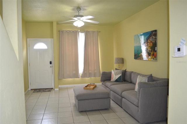 3870 SW 20th Ave Unit 1607, Gainesville, FL 32607 - living room with baseboards, a ceiling fan, light tile patterned flooring, and a healthy amount of sunlight