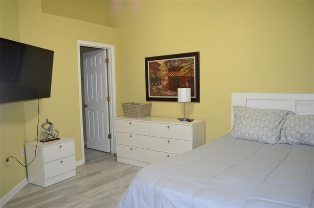 3870 SW 20th Ave Unit 1607, Gainesville, FL 32607 - bedroom featuring light wood-style flooring and baseboards