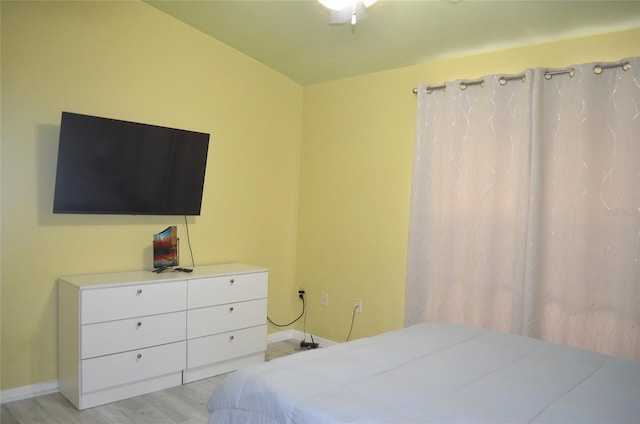 3870 SW 20th Ave Unit 1607, Gainesville, FL 32607 - bedroom featuring baseboards and light wood-style floors