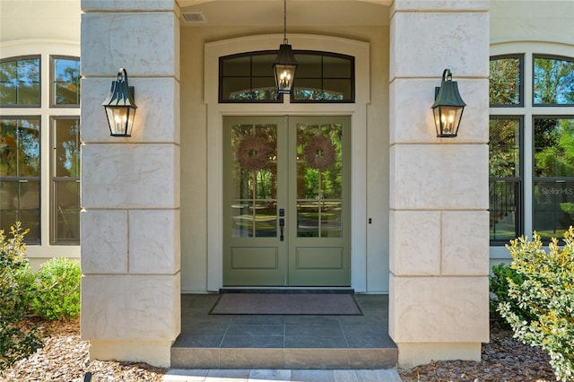 14819 NW 21st Ave, Newberry, FL 32669 - view of exterior entry featuring french doors and visible vents