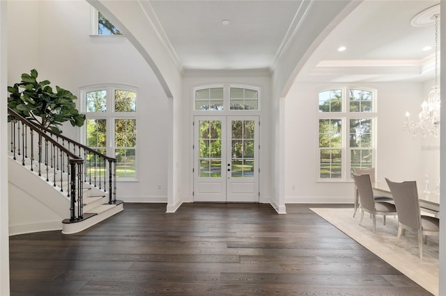 14819 NW 21st Ave, Newberry, FL 32669 - entryway with arched walkways, ornamental molding, french doors, and a chandelier