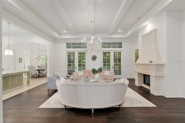 14819 NW 21st Ave, Newberry, FL 32669 - living area with a high end fireplace, french doors, beamed ceiling, a notable chandelier, and dark wood-type flooring