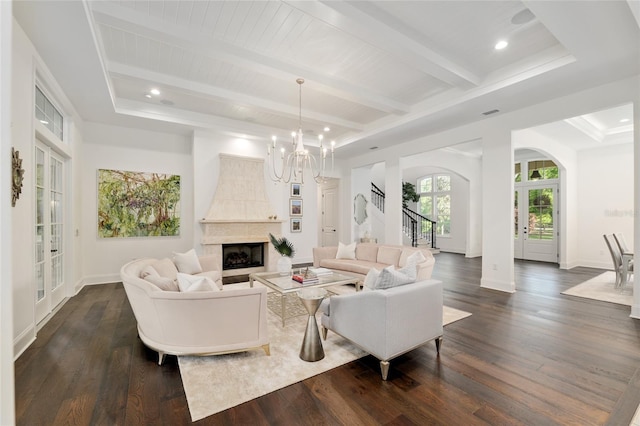 14819 NW 21st Ave, Newberry, FL 32669 - living area with dark wood finished floors, arched walkways, beamed ceiling, a fireplace, and a notable chandelier