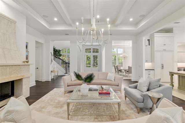 14819 NW 21st Ave, Newberry, FL 32669 - living room featuring stairs, a high end fireplace, an inviting chandelier, beamed ceiling, and dark wood-style floors