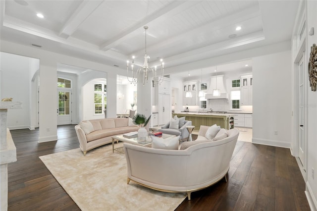 14819 NW 21st Ave, Newberry, FL 32669 - living area with arched walkways, dark wood-style flooring, beamed ceiling, and baseboards