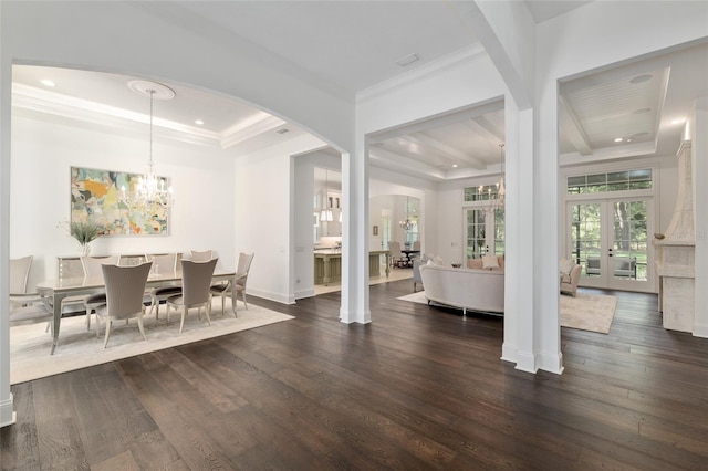 14819 NW 21st Ave, Newberry, FL 32669 - dining area with crown molding, a chandelier, arched walkways, a raised ceiling, and dark wood-style floors
