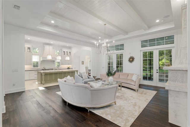 14819 NW 21st Ave, Newberry, FL 32669 - living area with dark wood-style floors, arched walkways, french doors, and visible vents