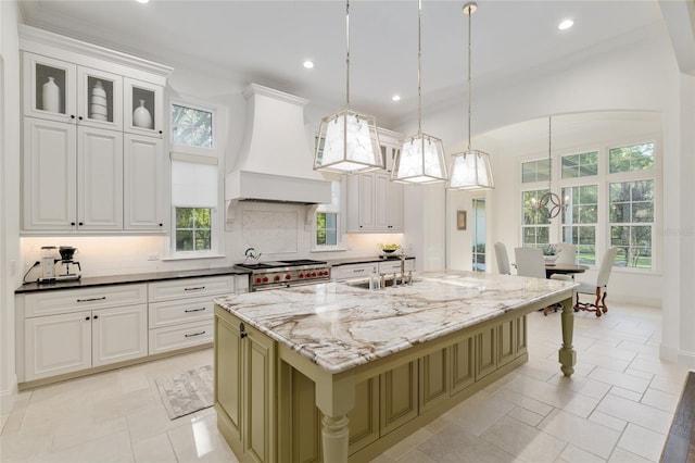 14819 NW 21st Ave, Newberry, FL 32669 - kitchen featuring dark stone counters, recessed lighting, decorative backsplash, custom range hood, and range with two ovens