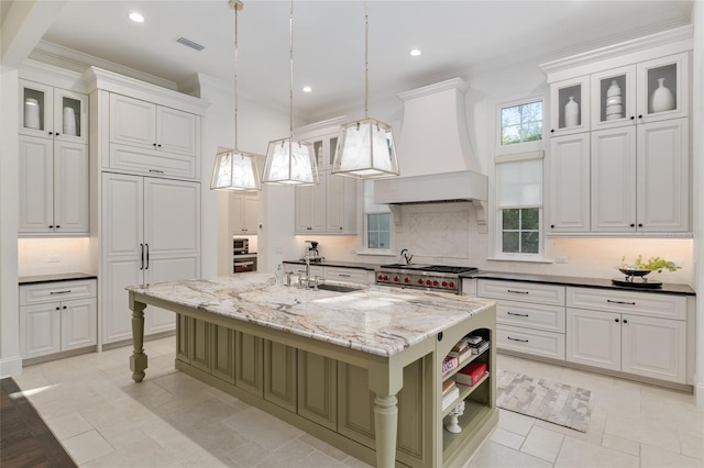 14819 NW 21st Ave, Newberry, FL 32669 - kitchen featuring tasteful backsplash, a sink, stainless steel appliances, custom range hood, and visible vents