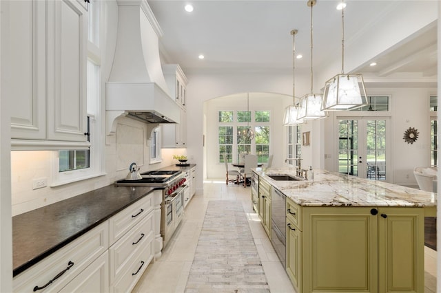 14819 NW 21st Ave, Newberry, FL 32669 - kitchen with a sink, decorative backsplash, french doors, premium range hood, and recessed lighting